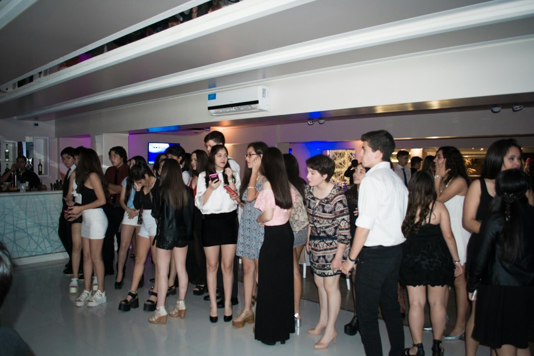 Elegant celebrity party with guests mingling and drinks